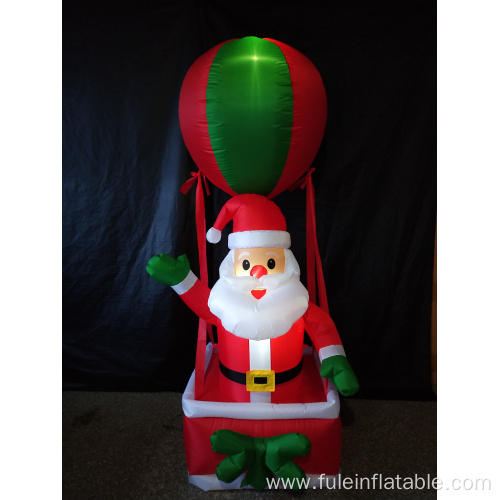 Happy holiday inflatable santa in hot air balloon